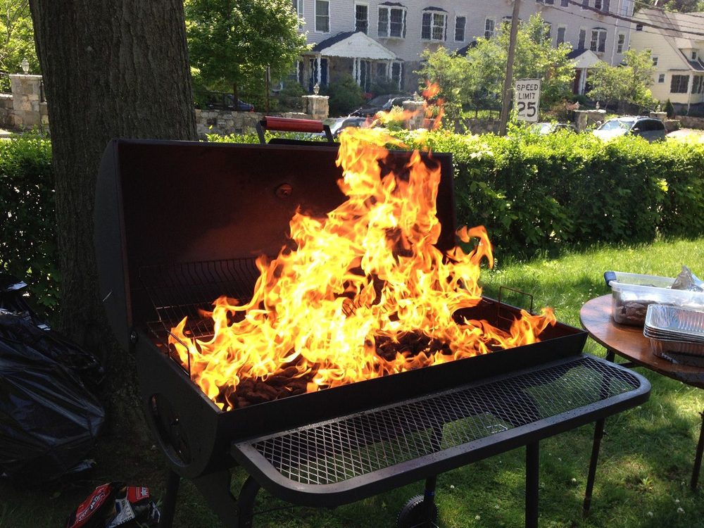 The grill with tall flames at the first fellowship BBQ, May 20, 2012.