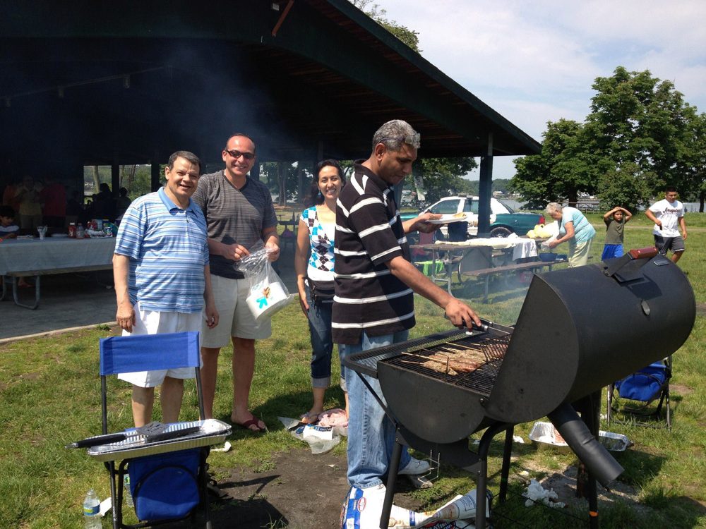 Friends gathered around the grill at the SPSA Memorial Day Fellowship BBQ, May 28, 2012.