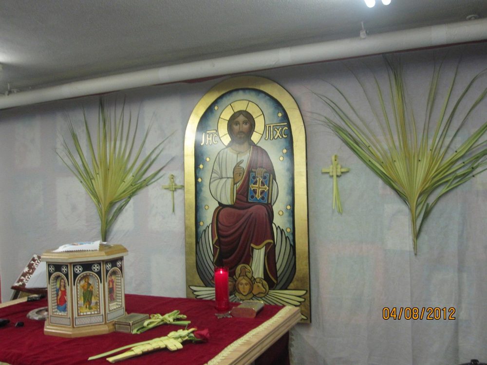 The altar and the icon of Christ framed by palm branches on Palm Sunday, April 8, 2012.