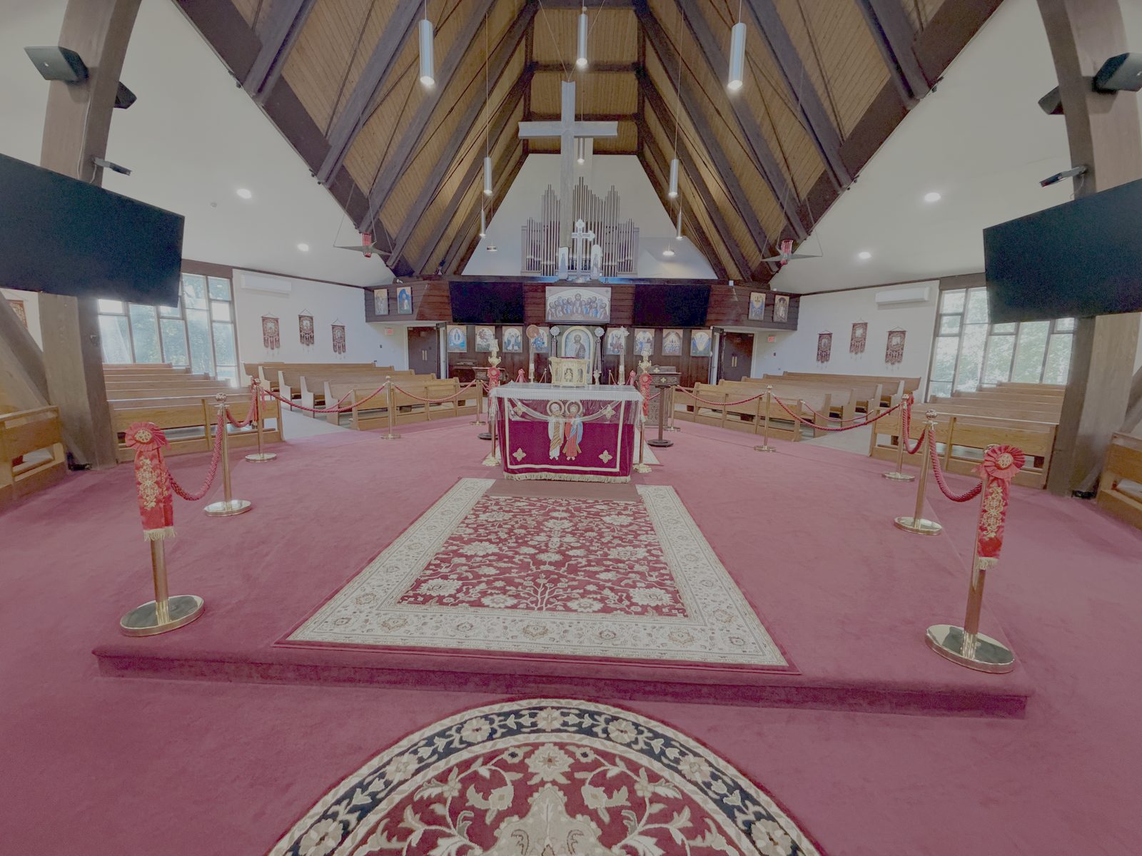 The altar in the middle of the church, seen from the back of the nave with the iconostasis beyond it