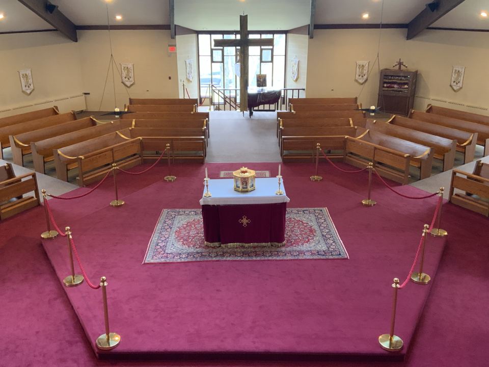 The six-sided sanctuary seen from above, with the altar in the center and pews on every side.
